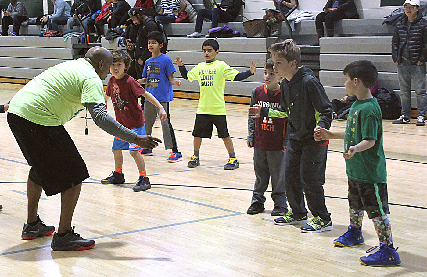 Former NBA player Gheorghe Muresan hosts youth basketball clinic